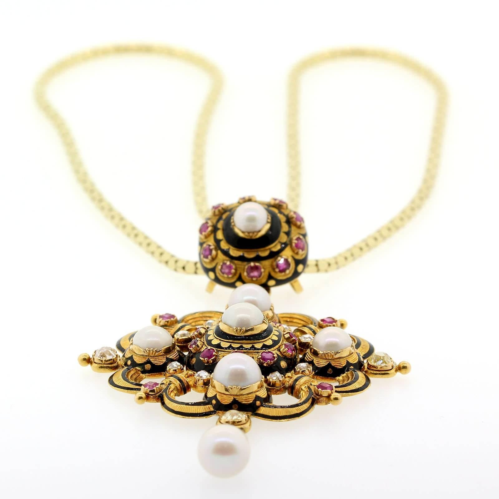 An exquisite antique European 18Kt yellow gold pendant set with seven untreated, natural white pearls, twelve Old Cut Diamonds and Pink Sapphires.  The pendant opens to a class cover compartment.   Circa 1890s.  It is dreamy!