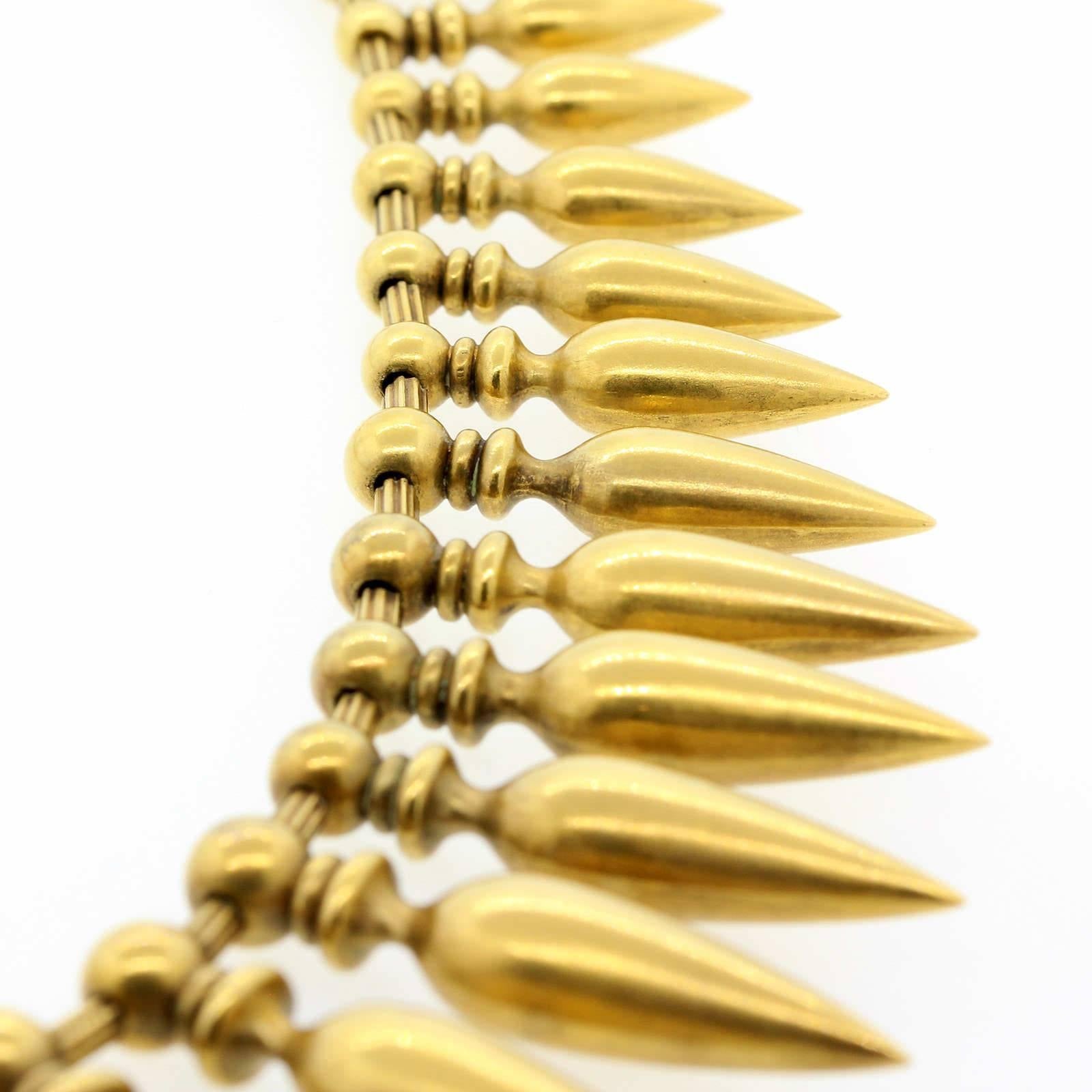 Victorian style 18KT yellow gold necklace designed with thirty nine graduating bullet-like dangles,  This is an exceptional conversation piece that will make you look and feel as a defiant queen.  This beautiful high design necklace feels