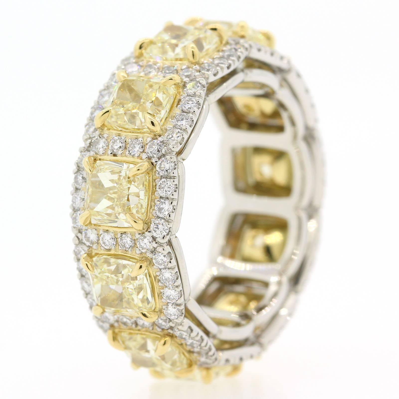 This is an eye popping ring!  The band is beautifully hand crafted in 18KT white gold and brilliantly set with 6.16 carats of Fancy Yellow Radiant Cut Diamonds of VS1 clarity.  To add more brilliancy the ring is accented with 1.23 carats of Round