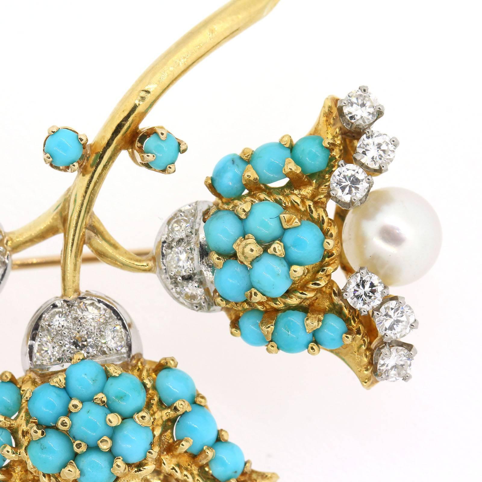 Elegantly Impressive,  three flower branch brooch set with a cluster of cabochon Turquoise and each flower featuring a 6.00 mm white cultured pearls and accented with one carat and half of Round Brilliant Cut Diamonds.  The brooch is fabricated in