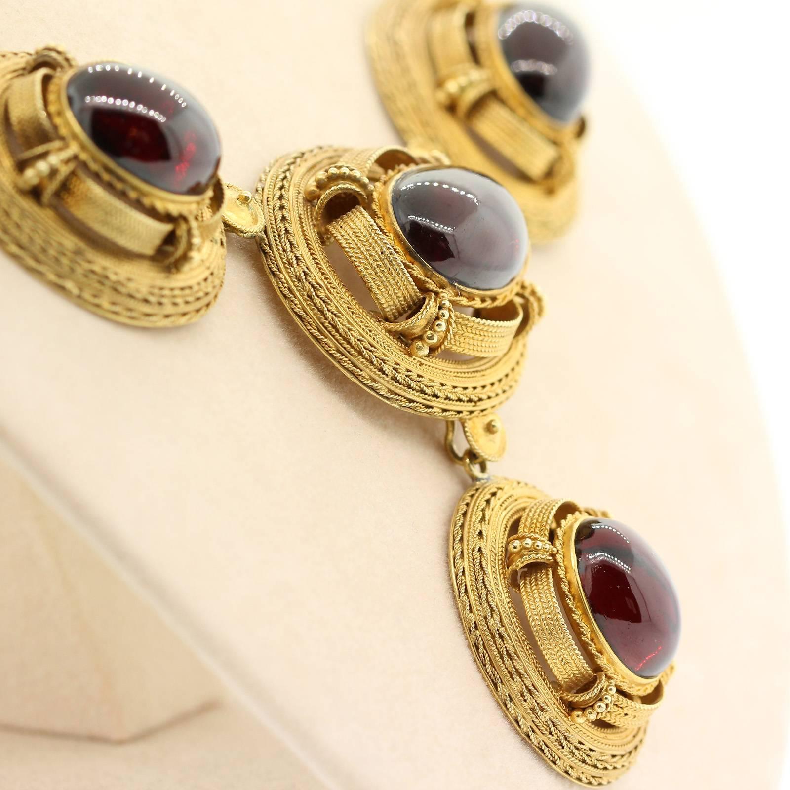 All original, antique, one of a kind handmade Garnet and 15KT yellow Victorian necklace.  The coveted English necklace is comprised of six elaborately engraved oval sections, each set with a cabochon Garnet.  The suspended bottom section is