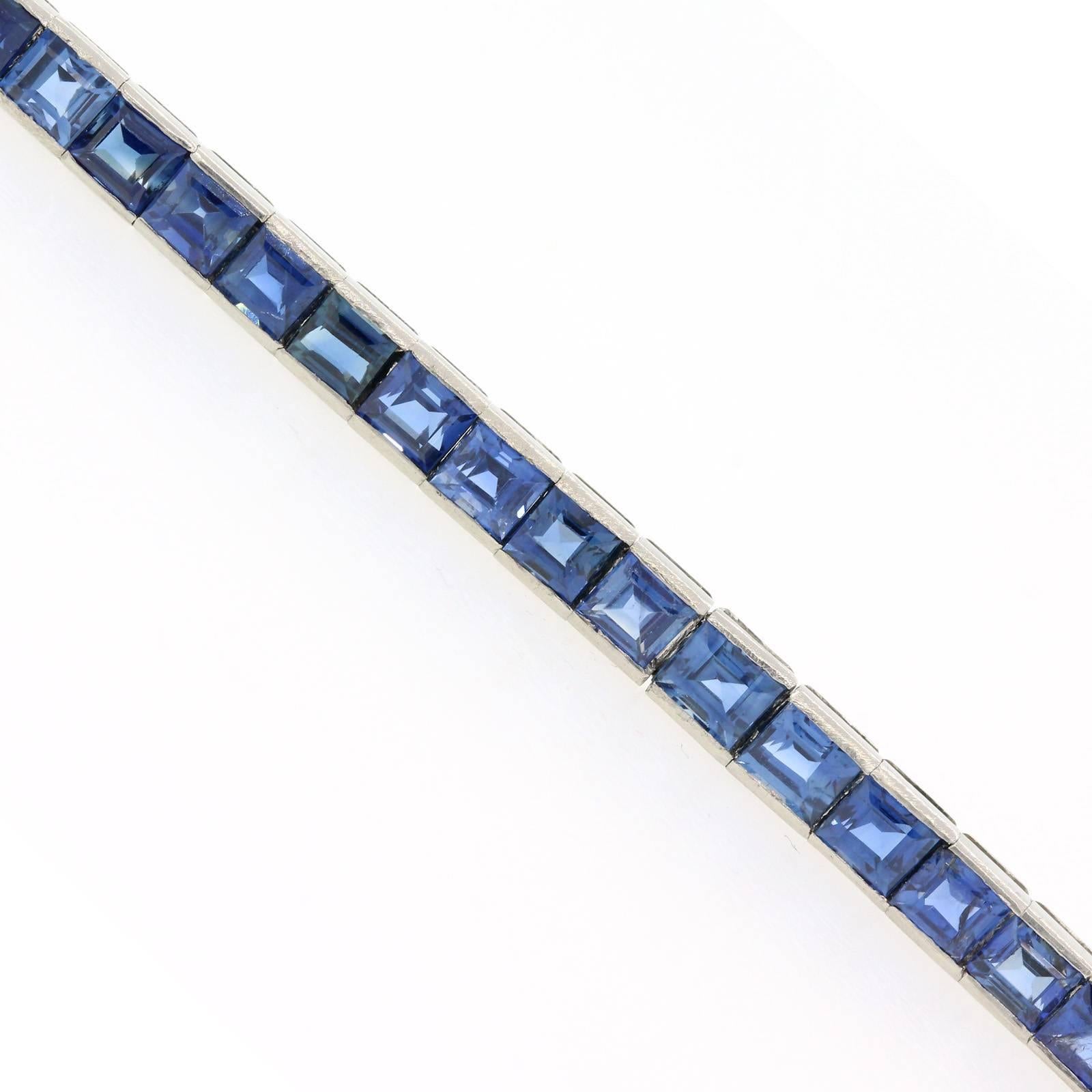A loyal companion to your everyday wardrobe, this vintage 1970s, 18KT white gold straight line bracelet set with seventeen carats of Natural Ceylon Blue Sapphires.
