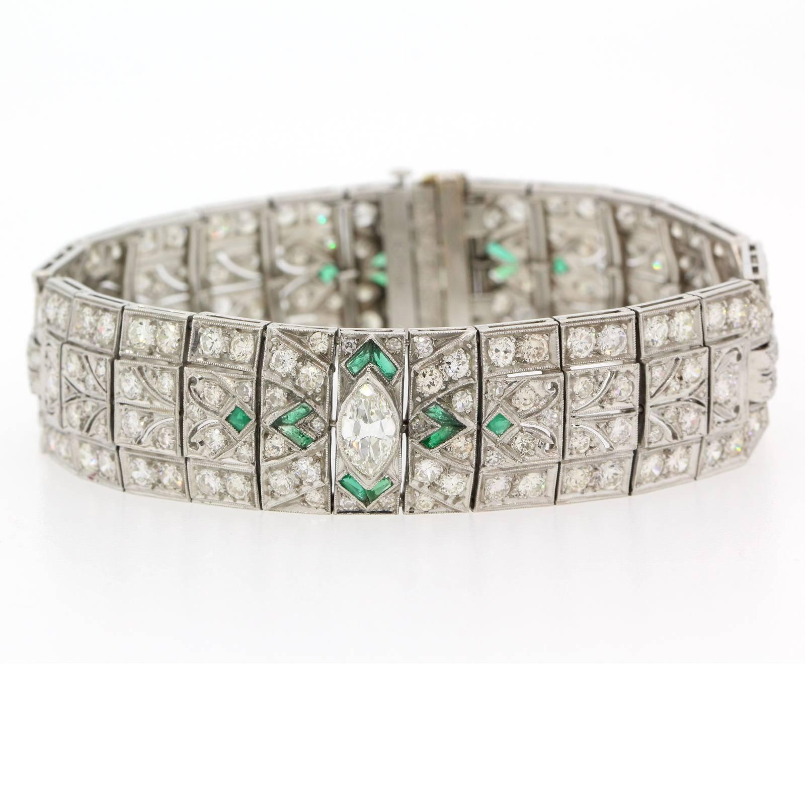 Impressively coveted Art Deco bracelet created in platinum and accented with two Marquise Cut Diamonds, one at the center and the second adorning the clasp.  This high quality bauble is accented with 12.50  carat of Old Cut Diamonds.  For a splash