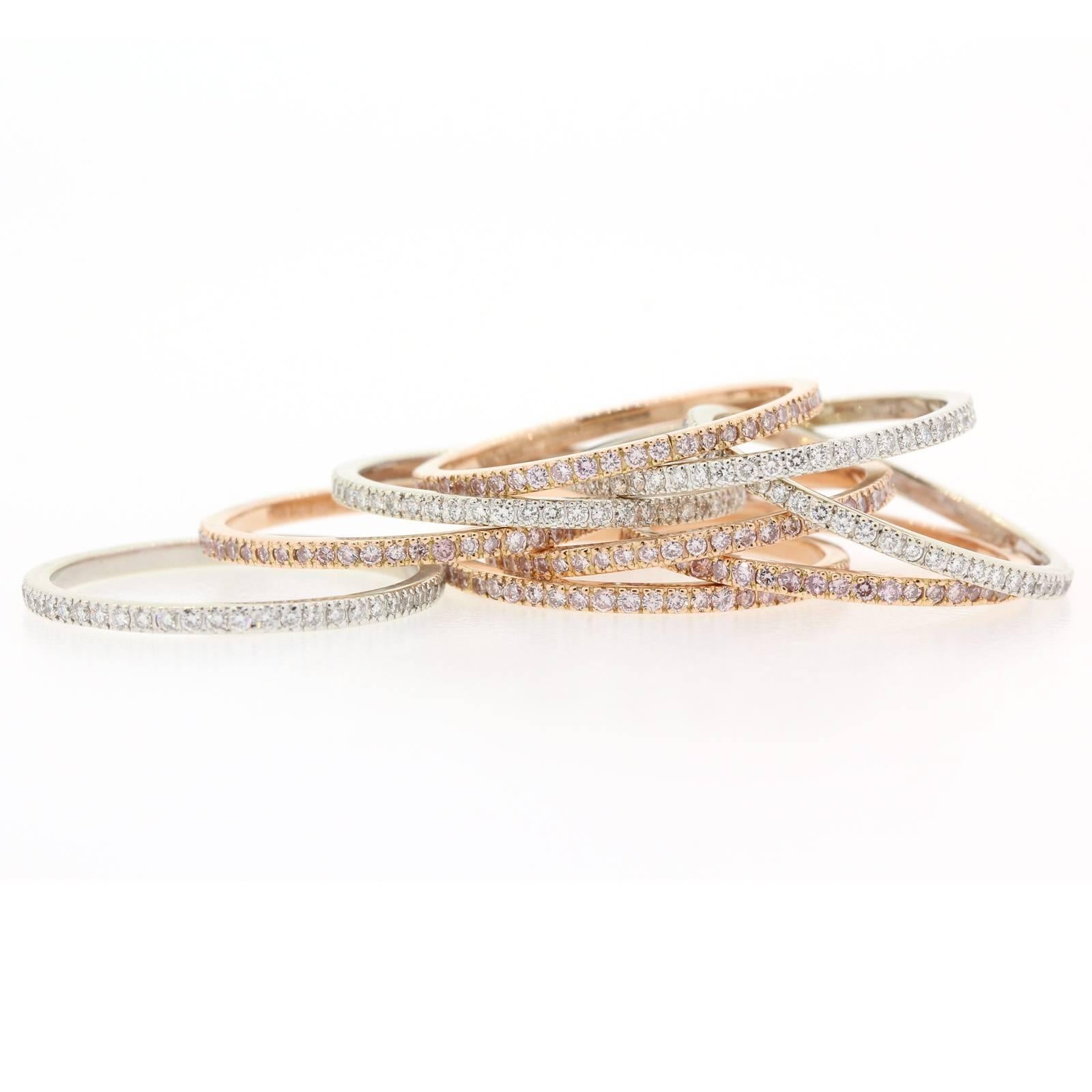 The beautiful set consist of five bands of Natural Pink Diamonds in 14KT Rose gold, and four White Diamond bands in 14KT White gold, all micro pave.  The bands are ring size 5 1/4.  This is the perfect stack!