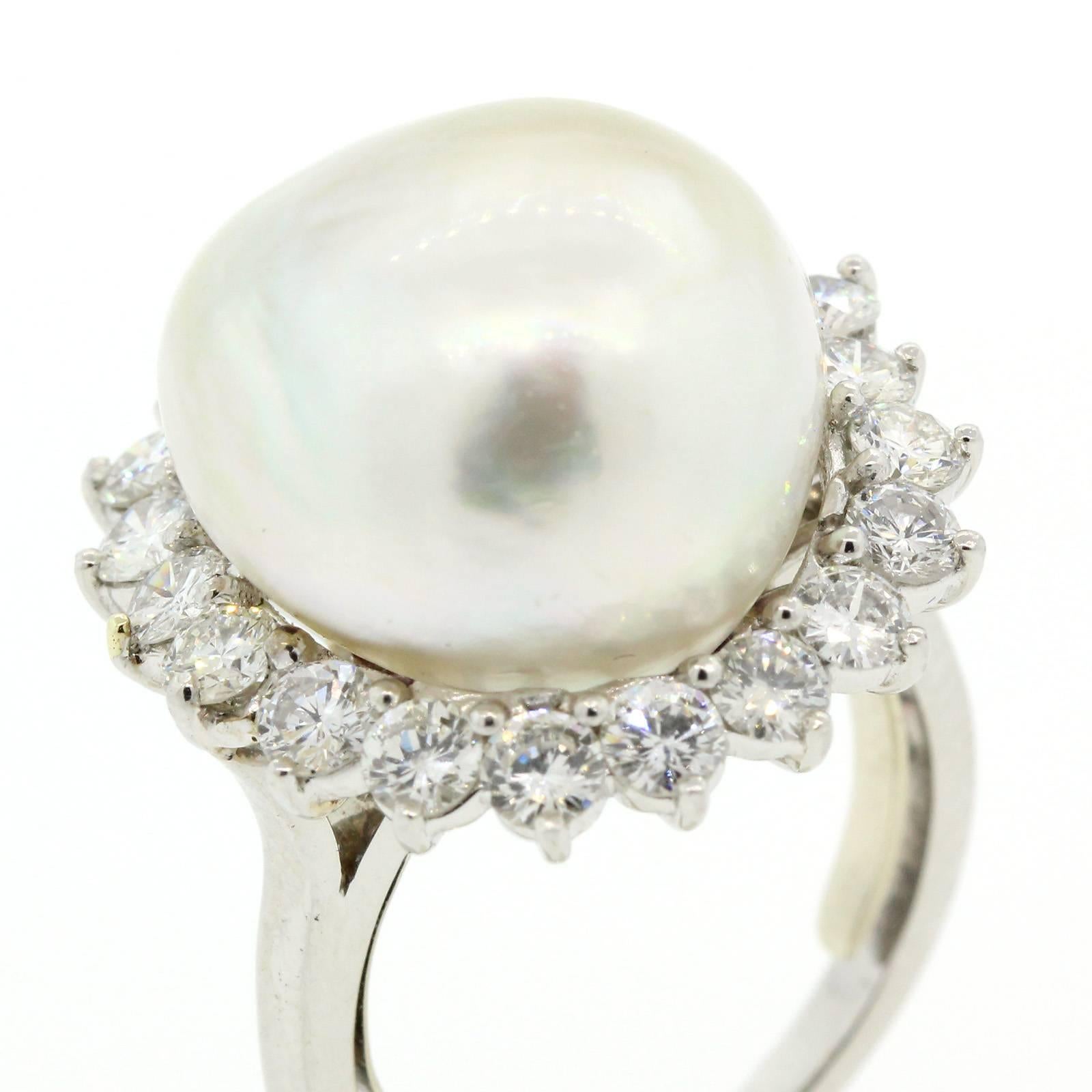 This 1970s platinum ring features a beautiful 16 mm White South Sea Pearl.  The baroque shape Pearl is surrounded by two carat eighty of Round Brilliant Cut Diamonds of G/H color - VS1 clarity.  This is the perfect cocktail ring!