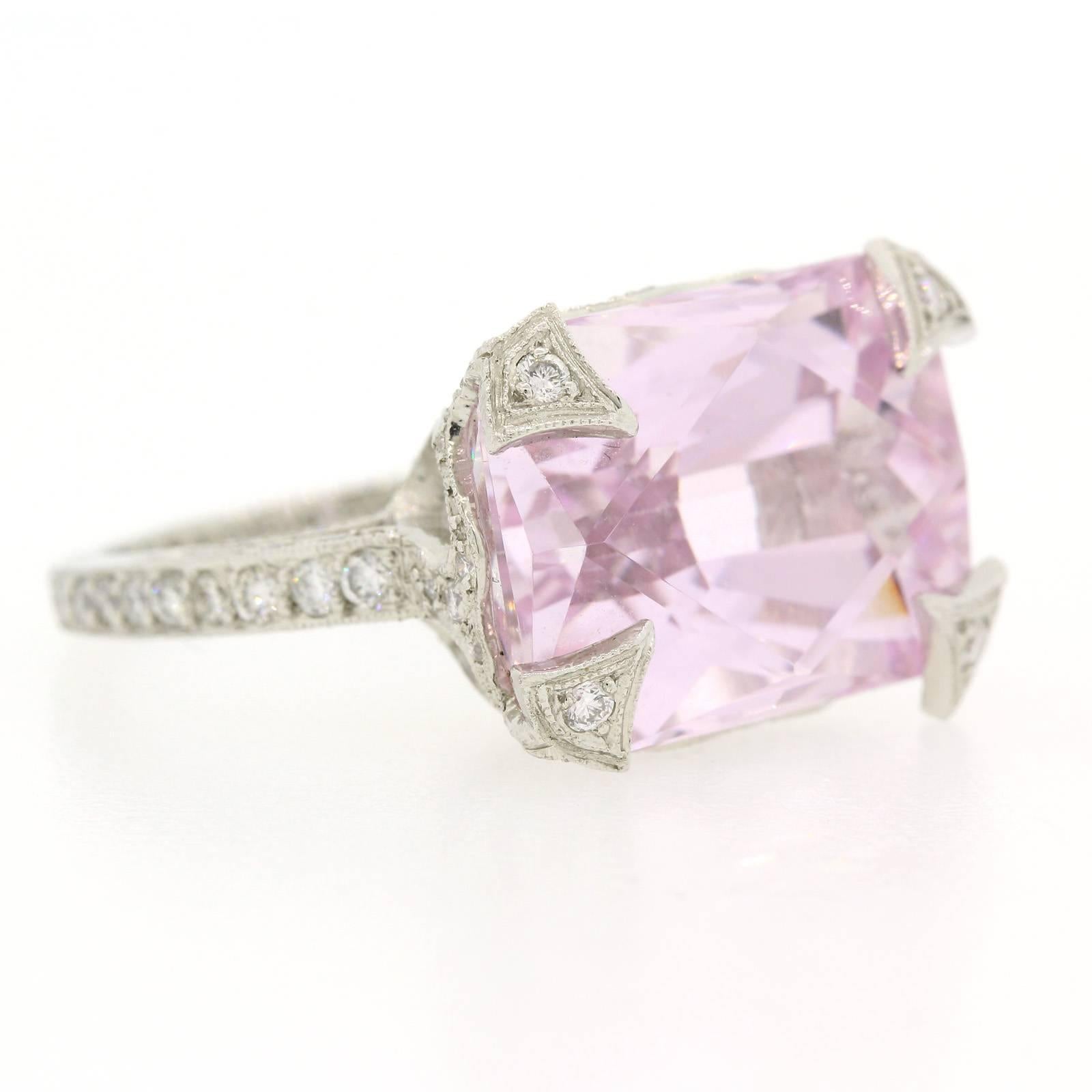 Cathy Waterman Rectangular Cut Kunzite  set in an elaborate open work platinum setting.  The ring is accented with numerous Round Brilliant Cut Diamonds and enhanced with delicate engraving and milgrain.   It is an impressive ring!