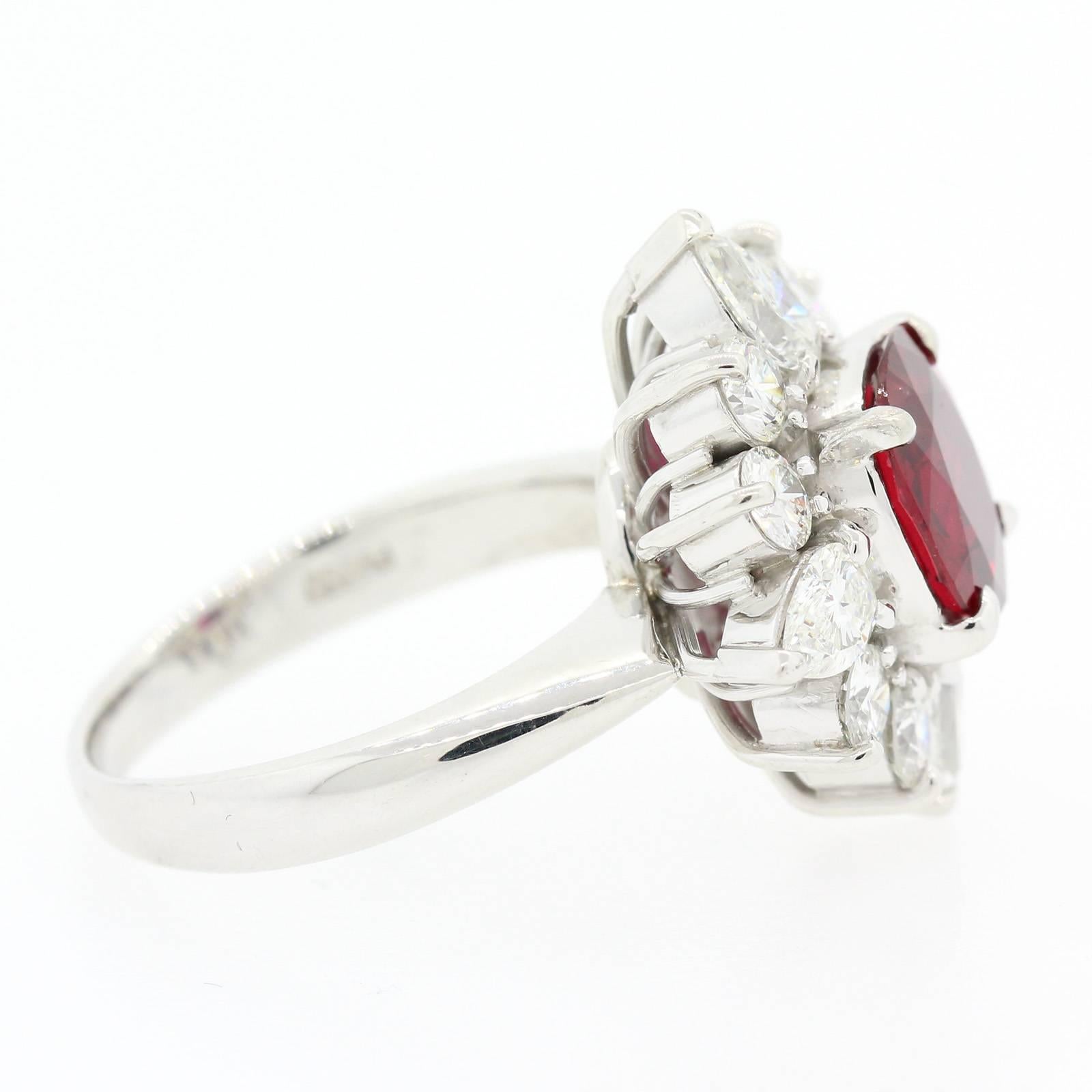 An luscious Ruby ring featuring a 2.15 carat Cushion Cut Ruby, G.I.A. certified  of Thai origin and heated.  The Ruby is surrounded by four Pear shape and eight Round Brilliant Cut Diamonds, all weighing 1.34 carat of H color - VS clarity.
Just