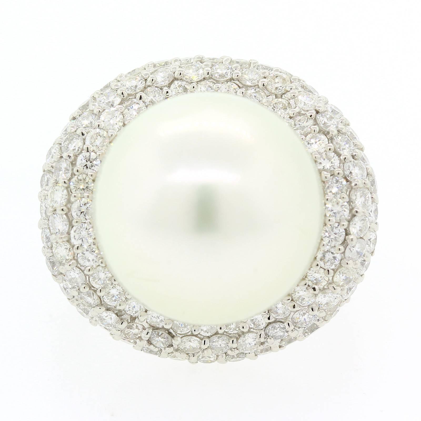 Lustrous 15.00 mm white South Sea Pearl ring.  This pretty Pearl is nestled in a 18KT white gold wave, pave set with 1.90 carat of Round Brilliant Cut Diamonds.  This impressive ring is ring size 7.  Yes, it is beautiful! 