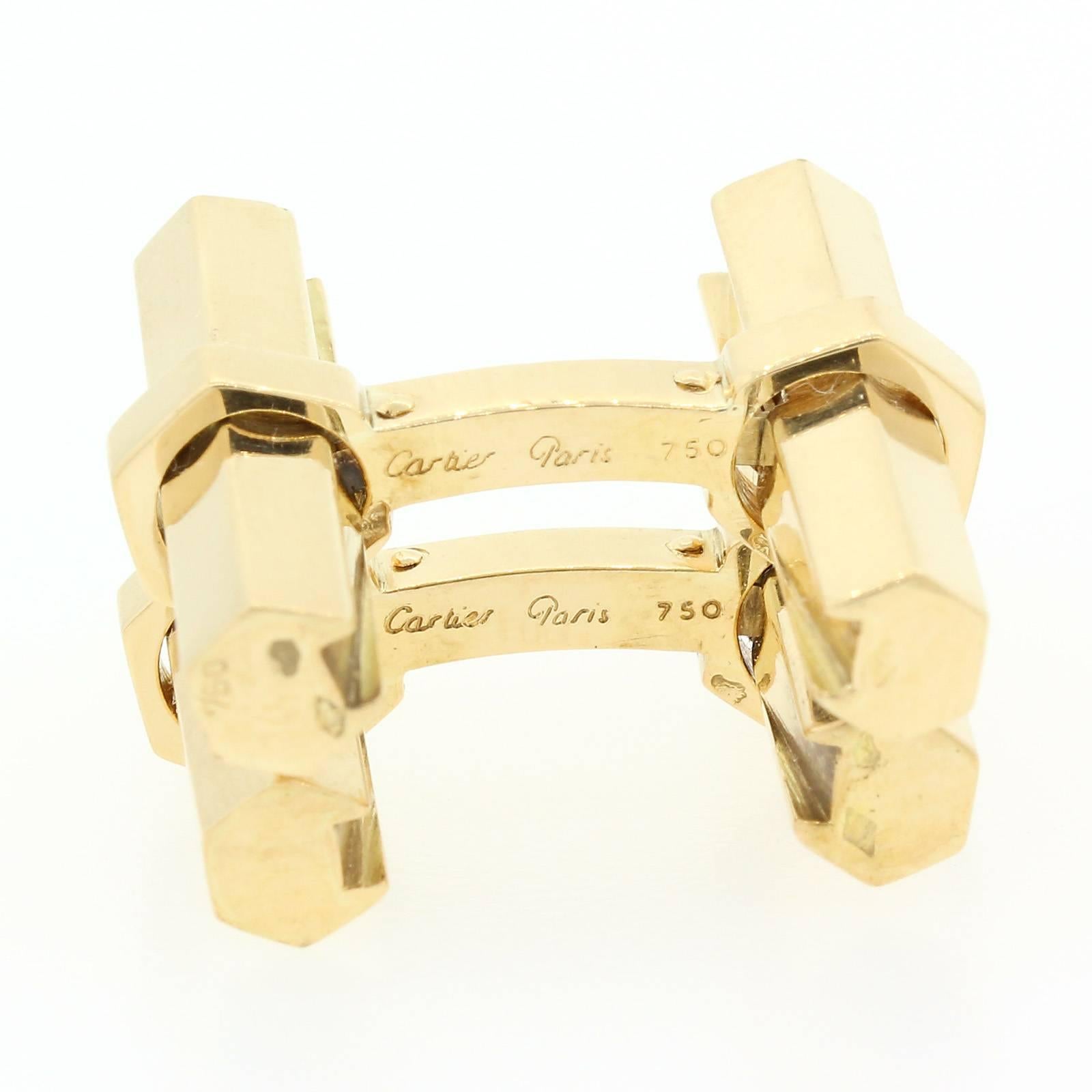 Cartier France Cufflinks of tubular design with removable hexagonal bars.  Each cufflink is signed "Cartier Paris 750" with French head and French maker hallmarks.  Circa 1970s.