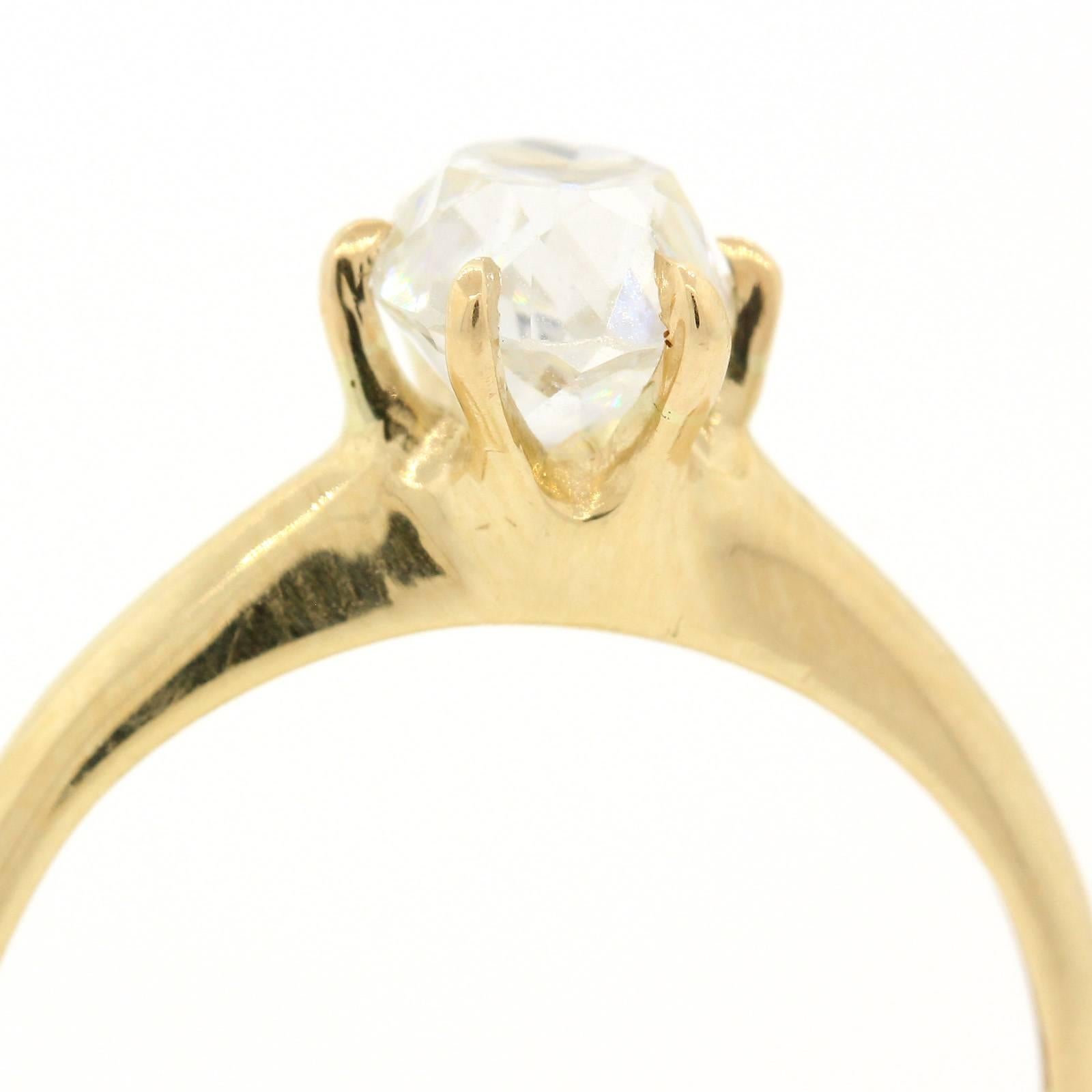 Less is more!  A gorgeous 1900s 18KT yellow gold ring featuring an Old  Cushion MIne Cut Diamond weighing 1.12 carats, certified E.G.L. USA  D color VS1 clarity.  The six prong setting is stamped 