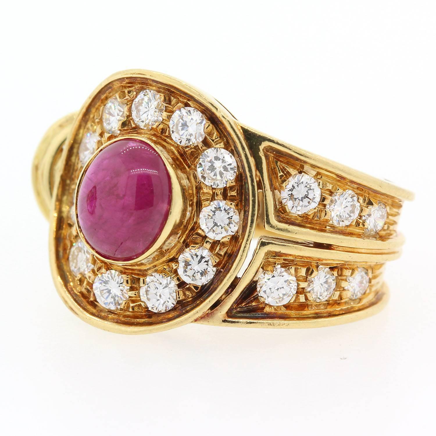 A stylish take on everyday earrings.  These earrings are fabricated in 18KT yellow gold each feature a cabochon cut Ruby.  They are accented with 2.25 carats of Round Brilliant Cut Diamonds  of G color - VS clarity.  The earrings are enhanced with a