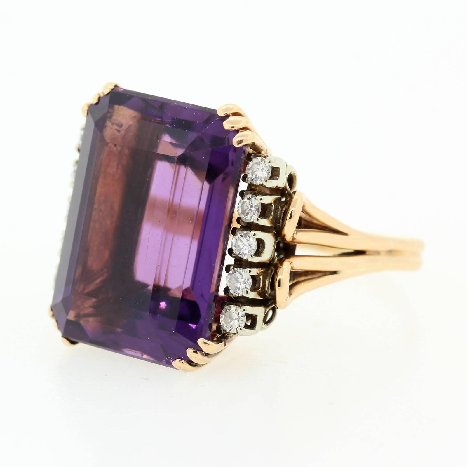 A coveted 1960  handmade 18KT rose gold ring featuring a beautiful 10.00 carats emerald cut Amethyst.  The  Amethyst is flanked by ten Round Brilliant Cut Diamonds set in 18KT white gold given the ring a balanced contrast. It is a big style piece!