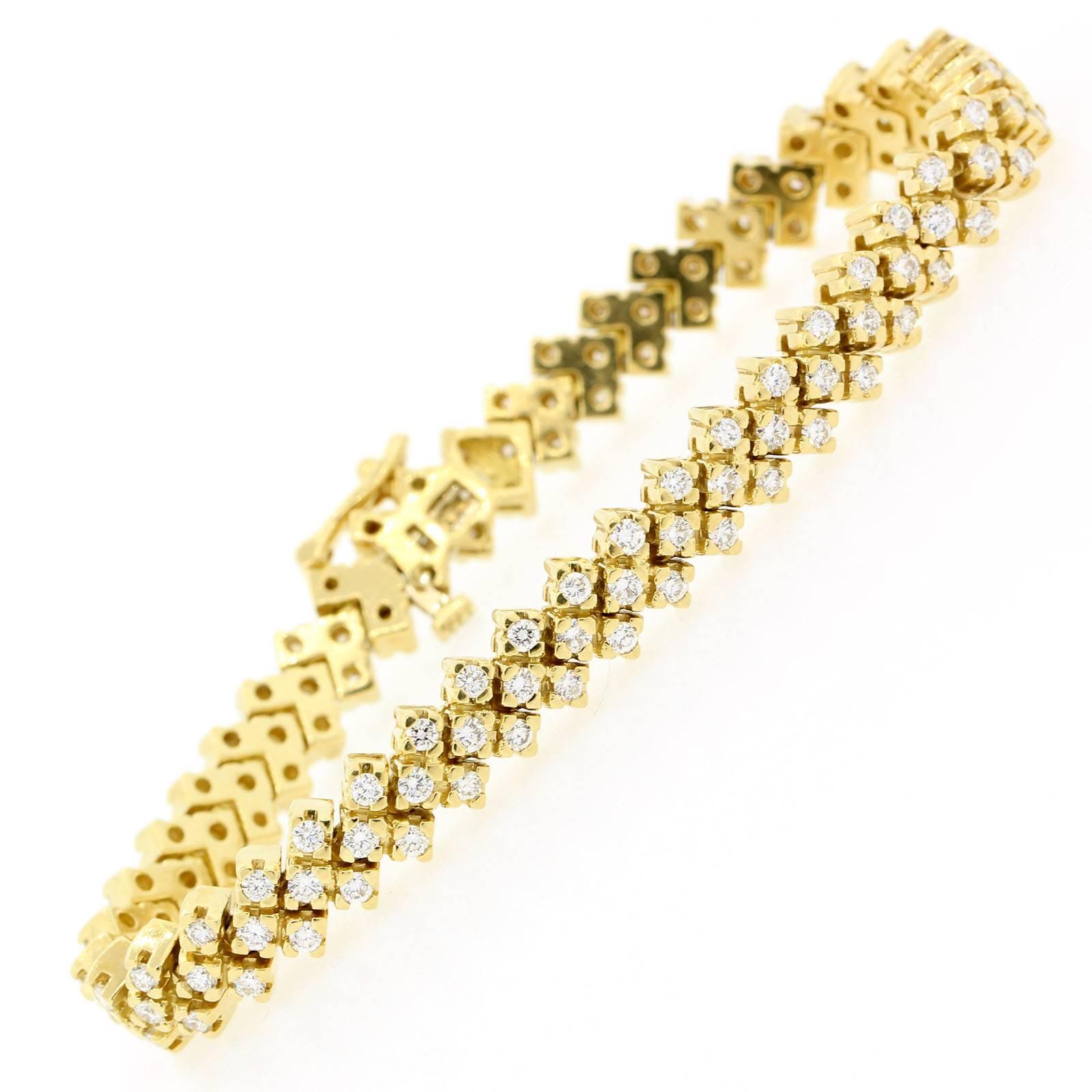 Perfect for everyday ware this articulated 18KT yellow gold bracelet, set with 4.30 carats of Round Brilliant Cut Diamonds of H/I color - VS clarity.  The 7 inch long bracelet is designed with arrow like links.  Circa 1970's.  