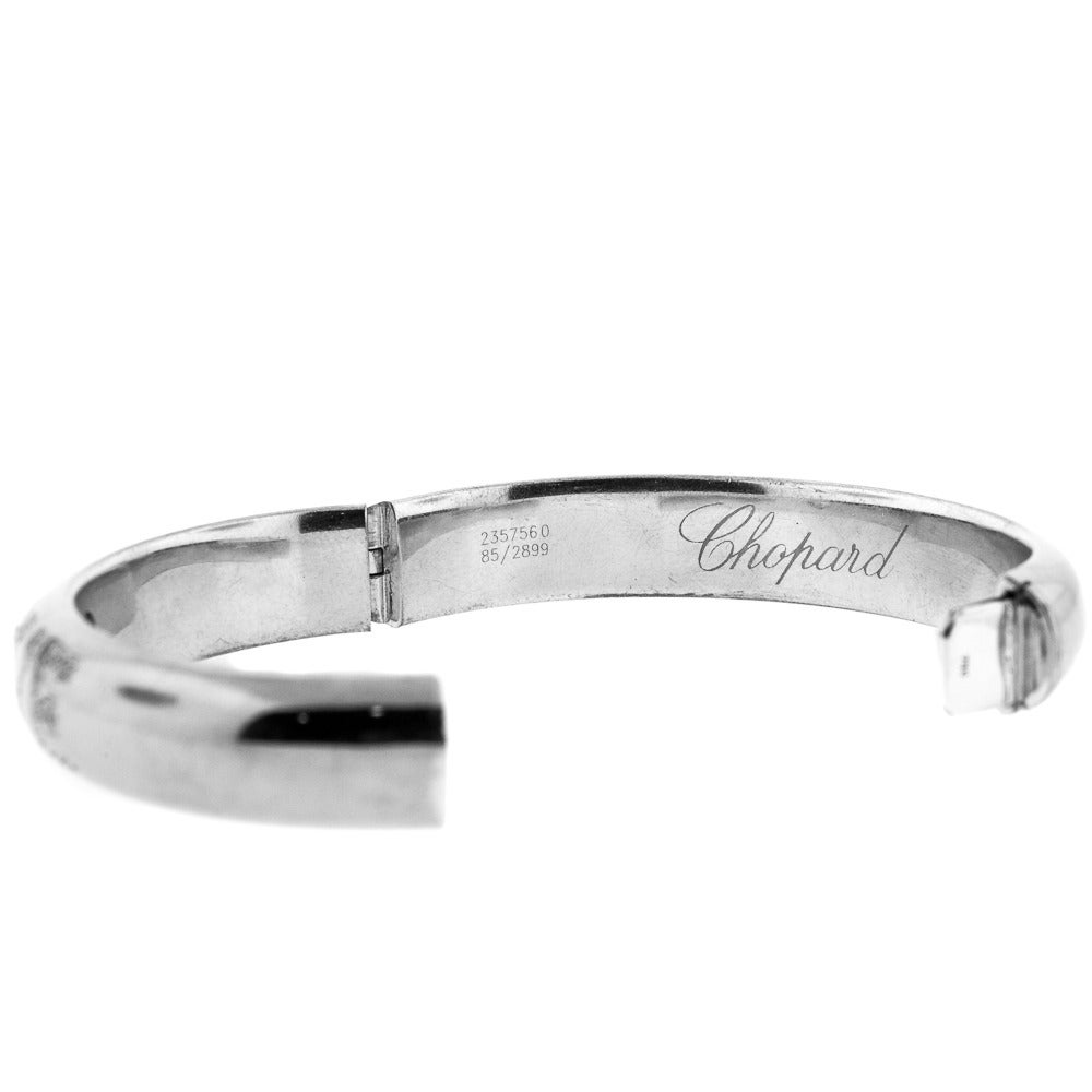 Stylish “LOVE” bangle, made from 18 KT White Gold, is a signature piece of the “Happy Diamond” collection from Swiss jewelry designer Chopard. What makes this piece so unique is the Diamond lettering. The word “Love” is written using forty four