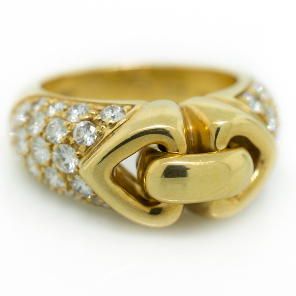 Bvlgari circa 1990’s buckle design ring set with thirty eight Round Brilliant cut diamonds and fabricated in 18KT yellow gold. The ring is size 6, and includes the original Bvlgari box.

SKU: R1579