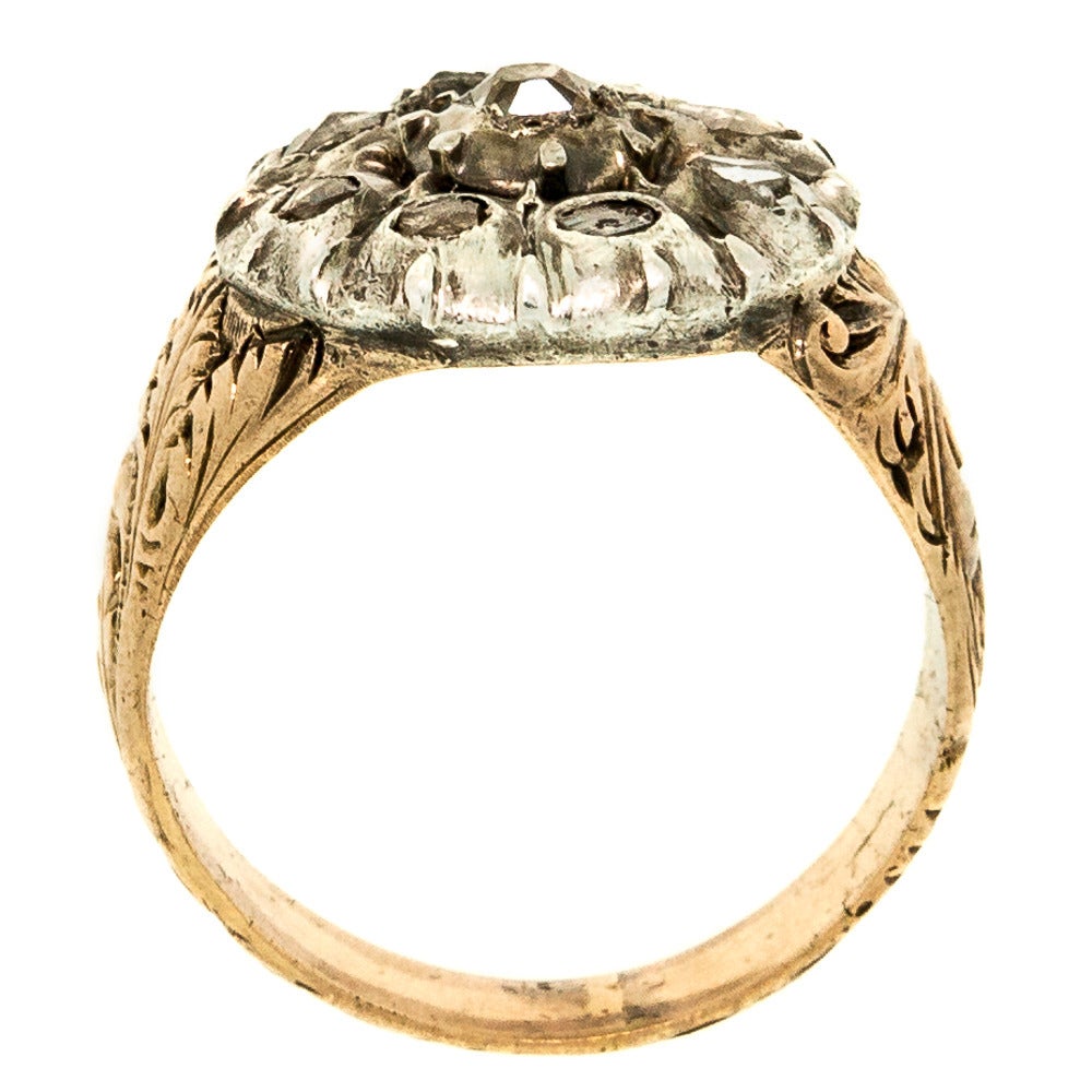 Georgian Rose Cut Diamond, Silver & Gold Ring fabricated in silver topped and set with Rose cut diamonds. The size 7 ring features an elaborate and beautiful hand engraved setting.

SKU: R1763