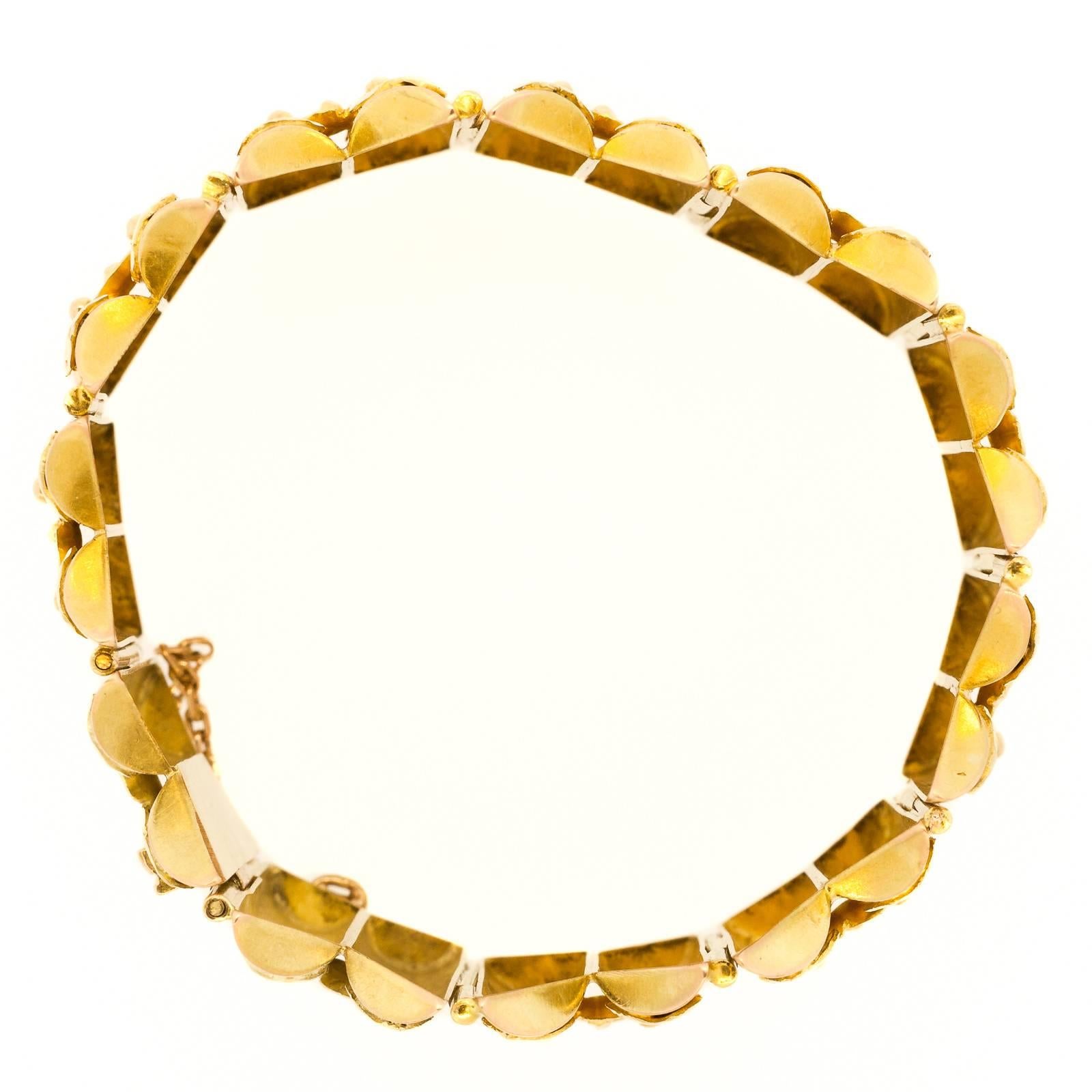 One of a kind unique vintage yellow & green gold wide bracelet is circa 1950’s. The one inch wide bracelet is designed as folding screens and fabricated in 14KT yellow with 14KT green gold applied leaf.

SKU:  B494