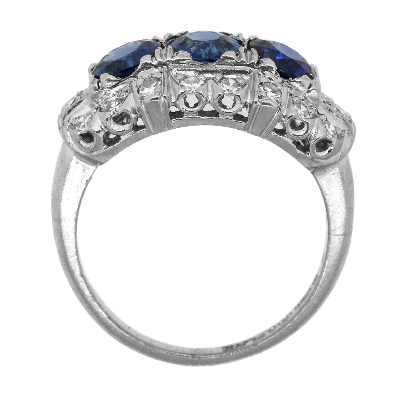 Gorgeous three stone Ceylon Sapphire of incandescent blue Ring surrounded by eighteen Single Cut Diamonds of H/I color – VS/SI clarity all set in a hand engraved platinum setting.  Ring size 6. Circa 1940’s.

SKU:  R2087