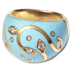 Anello in oro giallo 18 carati con turchese incastonato e intarsi, con diamanti incastonati