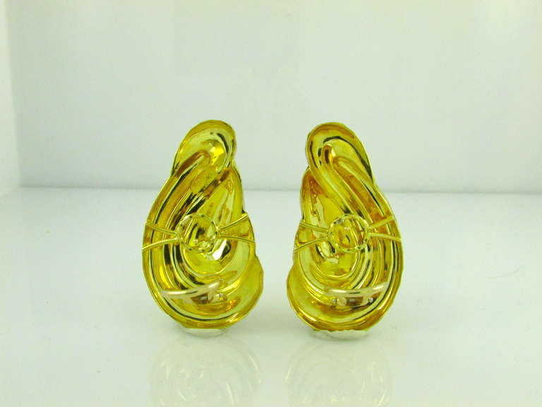 Large hammered 18KT yellow gold earrings. Posts and clip backs. Signed Dunay for Henry Dunay.