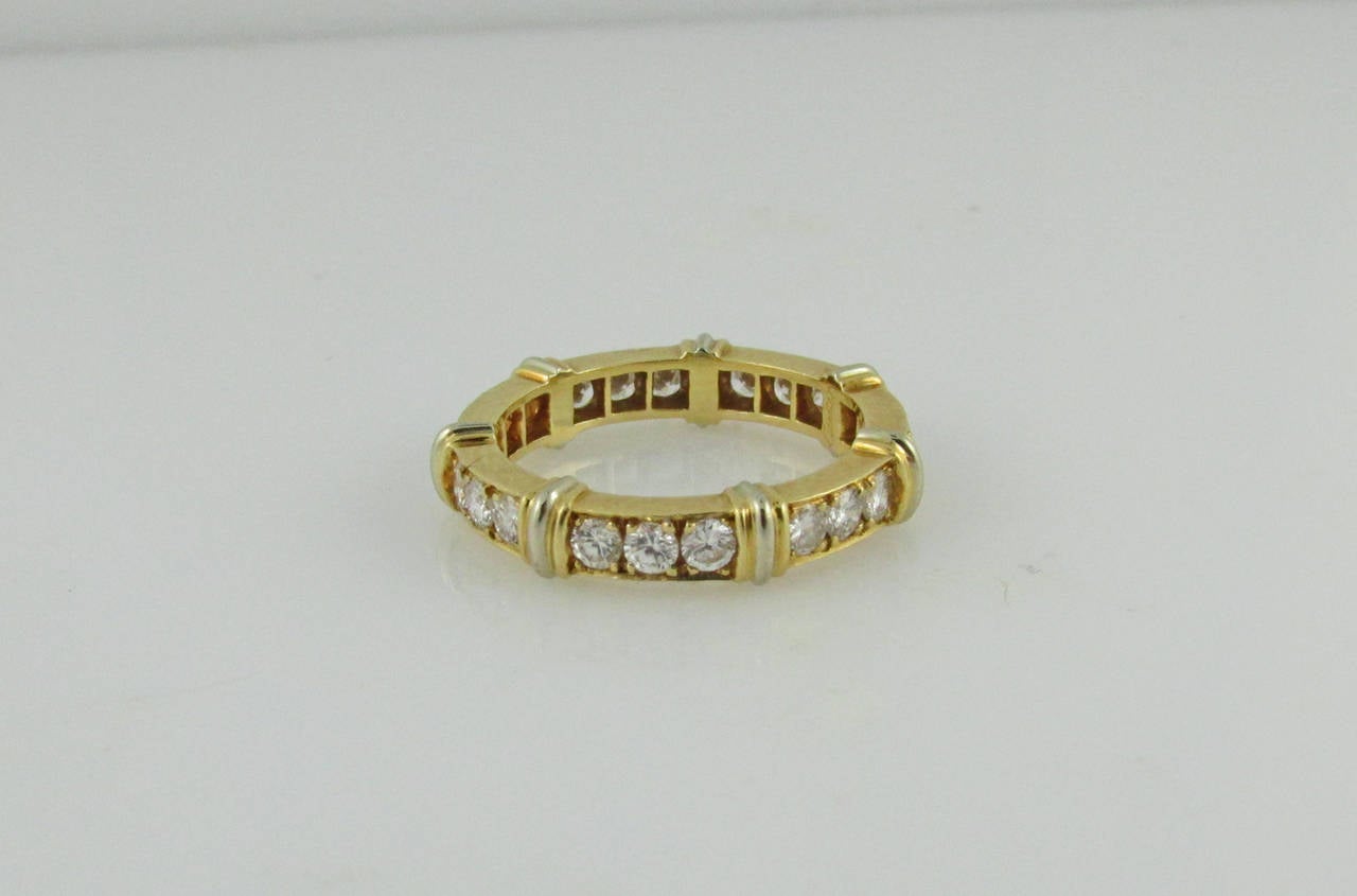 18KT yellow gold and diamond “Contessa” band set with round diamonds weighing a total of 0.87 carats. Size 4.5 Signed Cartier with original Cartier certificate.