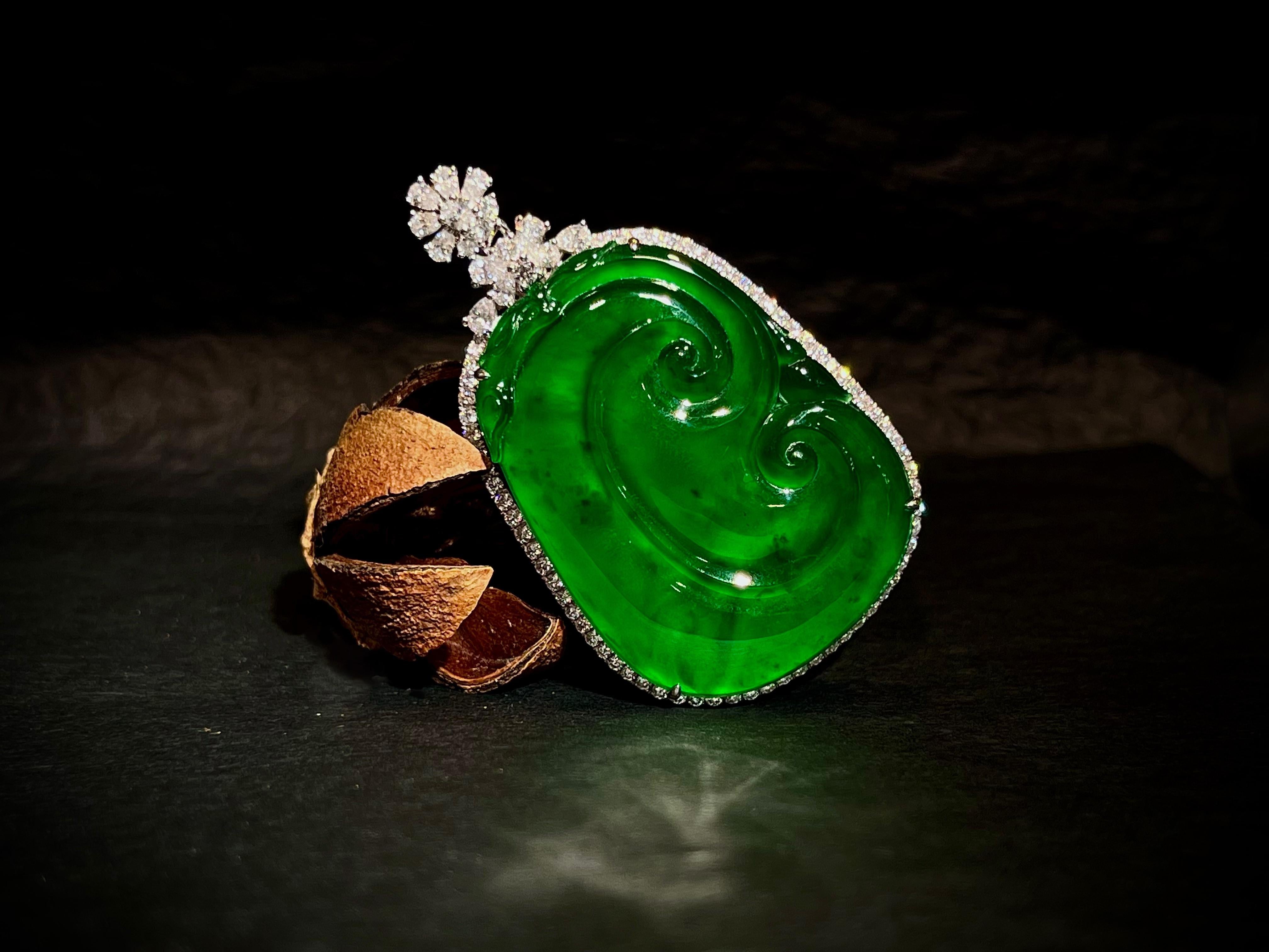 This exceptional natural RuYi jadeite pendant is crafted from premium-grade jadeite exhibiting intense, vivid coloration and remarkable transparency (known as 