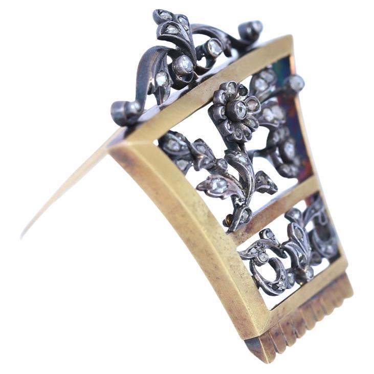 Unisex Victorian Brooch with Old-cut Diamonds. Gold & Silver. 1905. Delicate and fine work of the jeweler depicting flowers and natural ornament. The composition amazingly suggests that the natural motive shown in Silver has grown into a Gold frame.