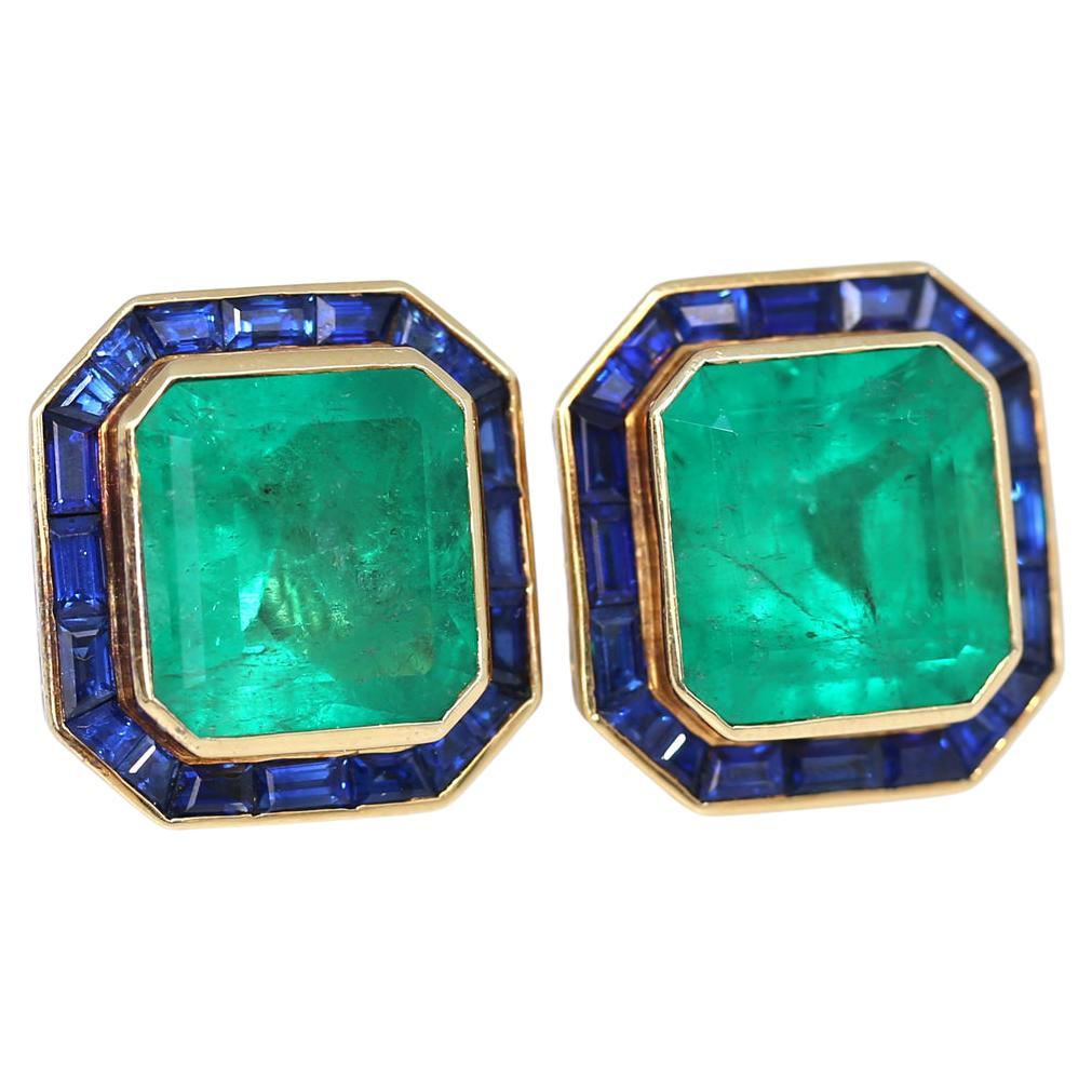 31 Carats Emerald Sapphire Earrings Yellow Gold Certified. Created in 1975. 
Magnificent and important Emerald Sapphire Earrings in 18K Yellow Gold. The line of rectangular deep blue Sapphires underlines the marvelous square-cut Emeralds. The green