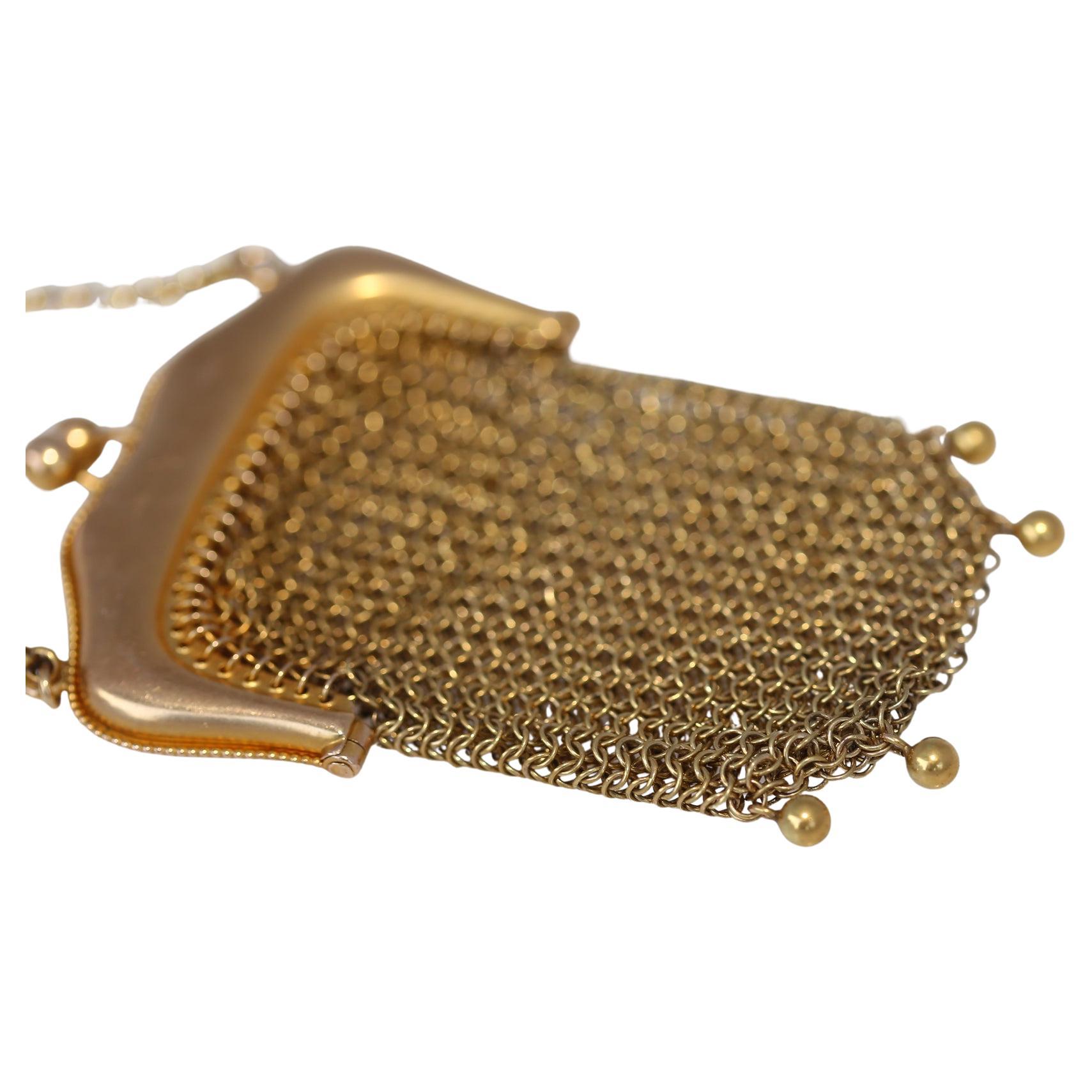 14K Gold Mesh Purse Chain, Created around 1895. 
14K Yellow Gold Mesh purse on a small chain representing a fine trend in Europe at the beginning of the 20th century, to actually use such a fine purse as pockets hanging down from the waist. A truly