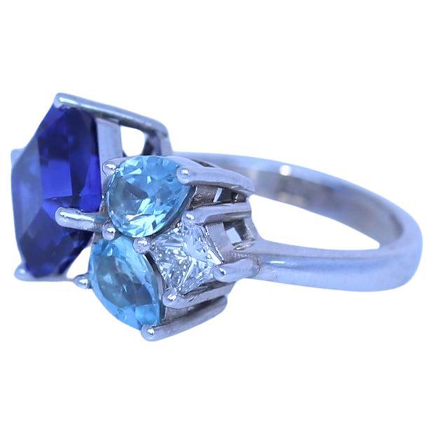 Tanzanite Diamond Ring 14K White Gold. Created in  2023.

6.8 Carats of fine Tanzanite and approximately 0.4 Carats of fine  Diamond. Superb design with amazing color grading from deep blue to light blue to clear white Diamonds. 
Stamped on the