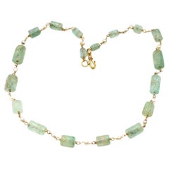 Collana di perle con smeraldi naturali colombiani intagliati da 175 carati, 1900