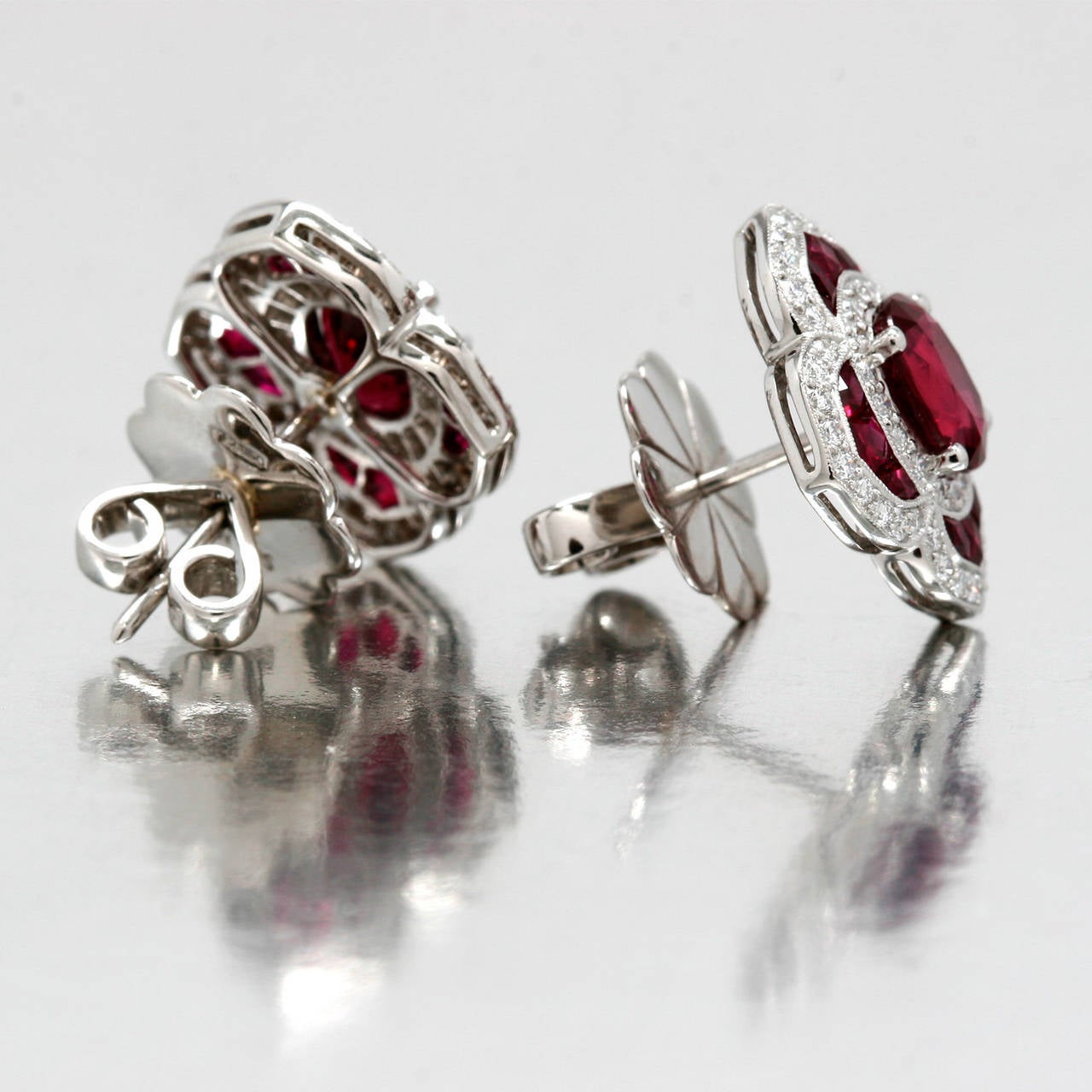 Spectacular Platinum Burma Ruby(2Oval Rubies=1.90ctw) and Diamond(108d=2.22ctw) Earrings, adorned with Smaller Rubies(24R=1.08ctw) with a Stud Post back. Weighing 9 grams with Platinum Backs.