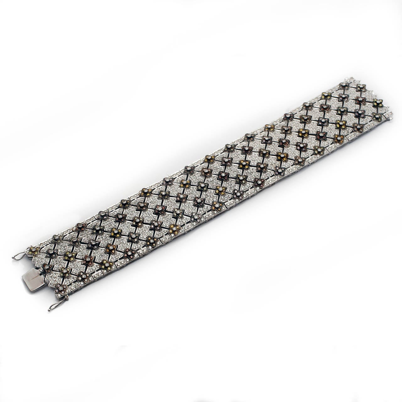 18K White Gold MULTI-COLOR NATURAL FANCY DIAMOND WIDE BRACELET 17.69CTW. A Wonderful array of natural color diamond shades including, Pinks, Purples, Yellows, Oranges, Greens, Russets, and White Diamonds. An incredible assortment.