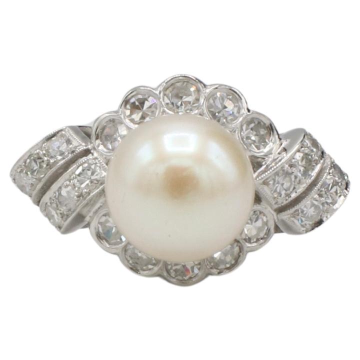 Anello retrò in platino con diamante naturale e perla coltivata a cupola