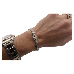 Pulsera tipo «belly» de oro blanco con filigrana Art Déco, diamantes naturales y zafiros