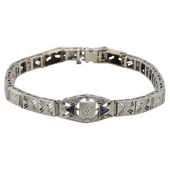 Pulsera tipo «belly» de oro blanco con filigrana Art Déco, diamantes naturales y zafiros