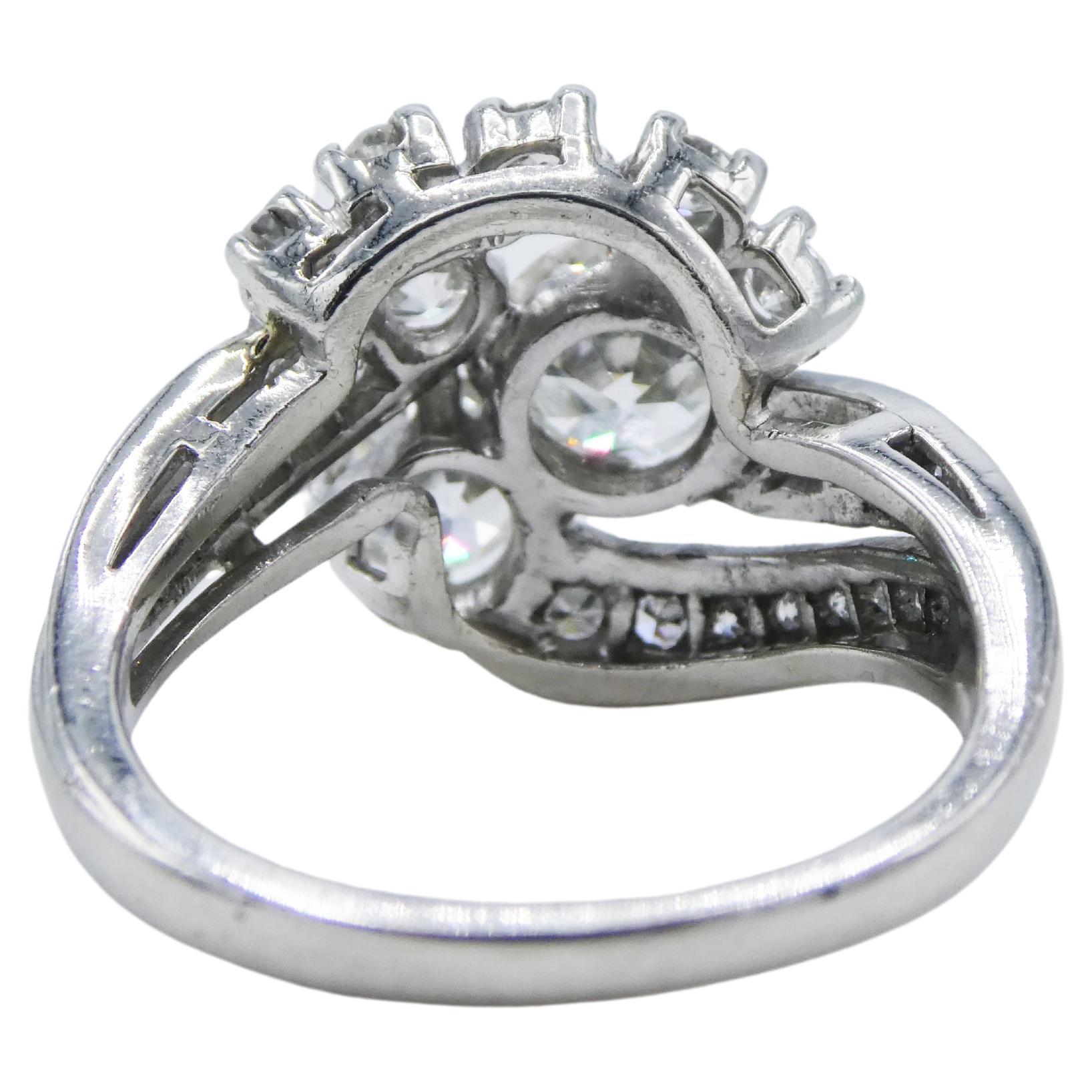 Old European Cut Diamond Platinum Cluster Cocktail Party Ring 1.50 CTW Size 5.75

Metal: Platinum
Diamonds: The two largest diamonds are 5.7mm and 4.8mm with an additional 26 old European cut diamonds throughout. Average color and clarity on all