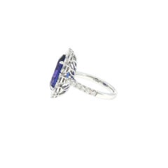 Oval shape 6.69ct Tanzanite and Diamond Halo setting Modern Ring in 18K Gold