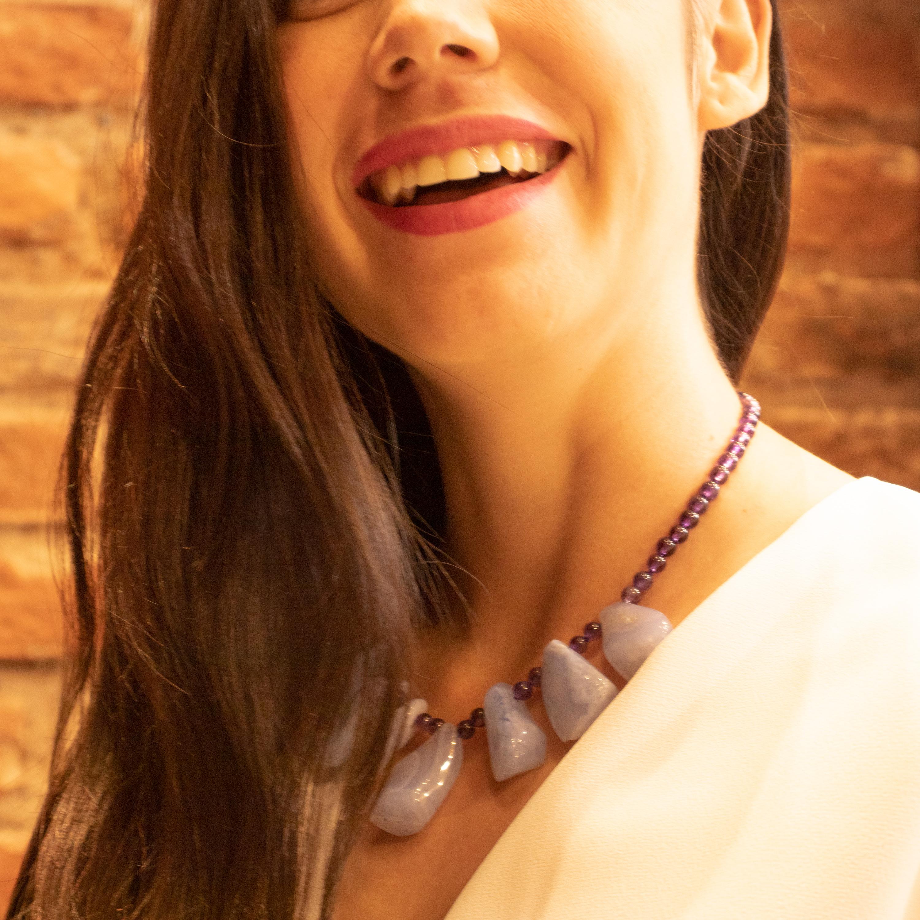 Summer vibes handmade necklace with precious stones that evoke the hues of blue of the mediterranean waters. This magnificent necklace is handmade with round amethyst and uneven cut chalcedony gemstones. These beads have different bold natural