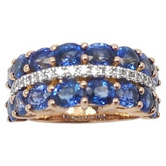 Bague en or rose 18 carats sertie de saphirs bleus et de diamants