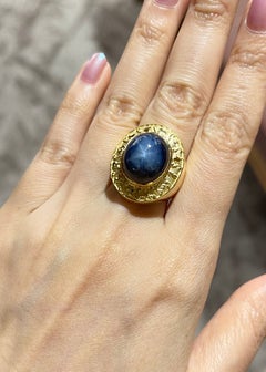 Blue Star Sapphire Ring set in 18K Gold Settings