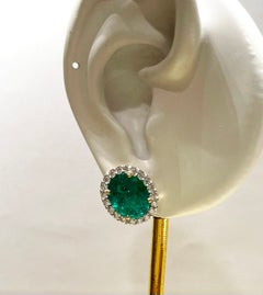 Emerald with Diamond Earrings set in 18K Gold Settings