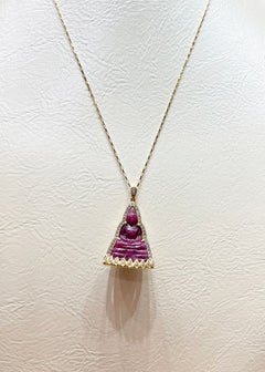 Ruby with Diamond Buddha Pendant set in 18K Gold Settings