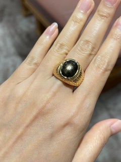 Black Star Sapphire Ring set in 18K Gold Settings