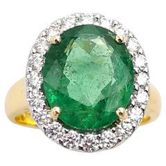 Emerald with Diamond Ring set in 18K Gold Settings