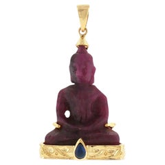 Carved Ruby with Cabochon Blue Sapphire Buddha Pendant set in 18K Gold Settings