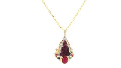 Carved Ruby, Cabochon Ruby and 8 Gems, Diamond Buddha Pendant set in 18K Gold