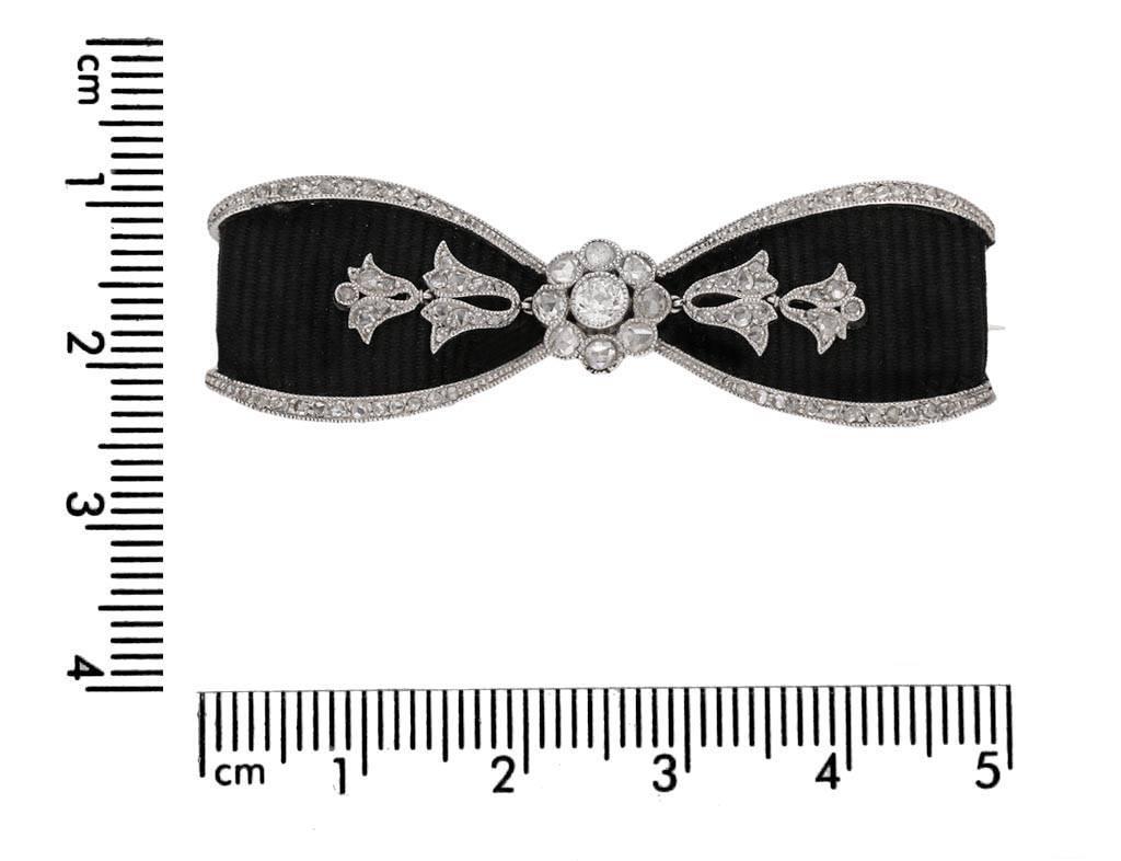 black bow brooch