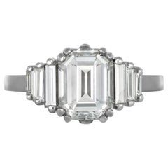 Vintage Diamond flanked solitaire ring.