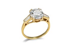 Anello solitario affiancato da un diamante Old Mine.